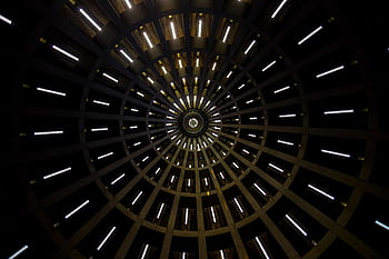 A mesmerizing abstract view of a circular dome with illuminated patterns creating a geometric design. HD wallpaper