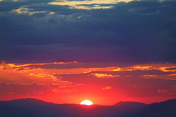 Captivating sunset over Erzurum mountains, with vivid colors and dramatic cloud formations. HD wallpaper