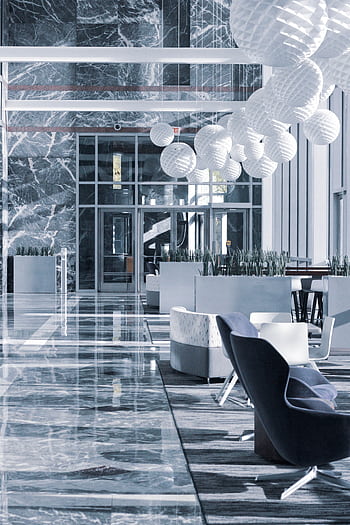 Elegant hotel lobby with marble floors and modern furniture design. HD phone wallpaper