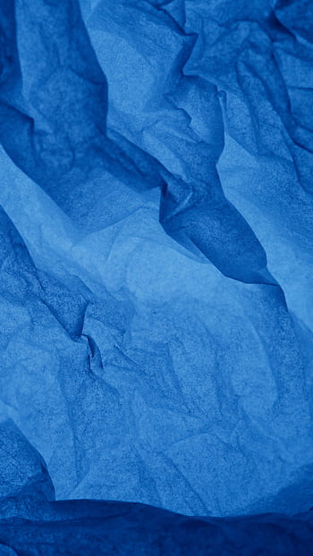 Close-up of crumpled blue paper creating a textured abstract background. HD phone wallpaper