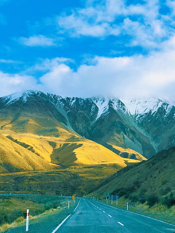 que view of snow-capped mountains and open road in Canterbury, New Zealand. HD phone wallpaper