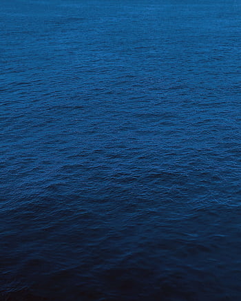 Captivating dark blue ocean surface with rich textures, ideal for and backgrounds. HD phone wallpaper