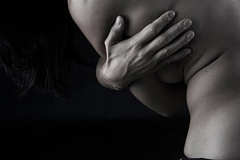 A captivating black and white nude portrait showcasing elegance and sensuality. HD wallpaper