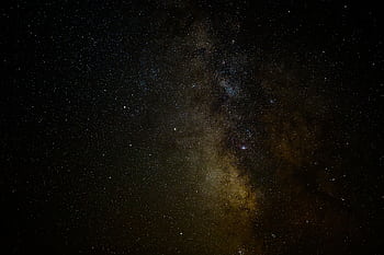 A breathtaking night sky showcasing the Milky Way galaxy, filled with countless stars and celestial formations. HD wallpaper