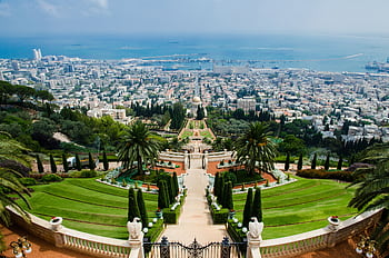 Stunning aerial view of Bahá'í Gardens and Haifa cityscape, a prominent tourist landmark in Israel. HD wallpaper
