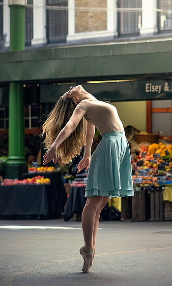 Ballerina, Graceful poses, Market backdrop, Elegant beauty HD phone wallpaper