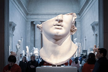 Greek marble head bust on display in a New York City museum exhibit. HD wallpaper