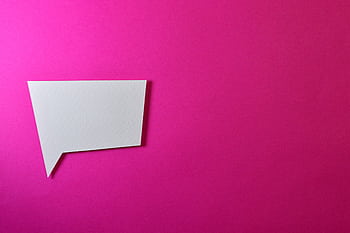 A white speech bubble on a vibrant pink background, perfect for text overlays. HD wallpaper