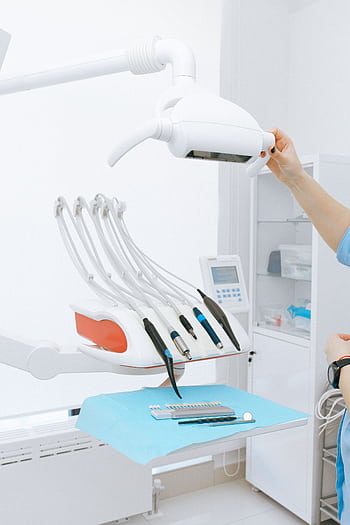 A clean, modern dental office showcasing dentist equipment and tools. HD phone wallpaper