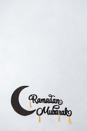 Minimalist Ramadan Mubarak greeting card design with crescent and tassels, ideal for festive occasions. HD phone wallpaper