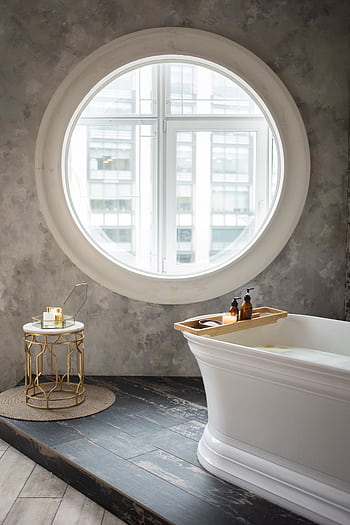 A luxurious bathroom featuring a standing tub and elegant decor. HD phone wallpaper
