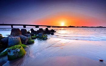 BEAUTIFUL END of A DAY, bridge, sunset, ocean, stones, beach HD wallpaper