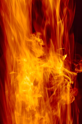 Close-up of intense flames creating a dramatic and fiery background. HD phone wallpaper