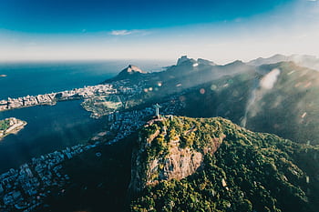 Stunning aerial view of Christ the Redeemer overlooking Rio de Janeiro's breathtaking landscape. HD wallpaper