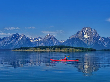 In silent waters, blue, boat, sea, peaceful, mountain, lake, reflection, waters, sky HD wallpaper