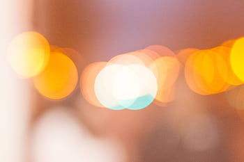 A soft-focus abstract with warm bokeh lights creating a dreamy effect. HD wallpaper