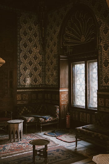 Ornate Egyptian interior with detailed patterns, traditional furniture, and arched window. HD phone wallpaper