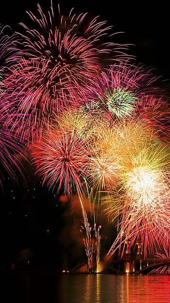 Colorful firework show, Explosive visuals, Nighttime festivities, Eye-catching display HD phone wallpaper