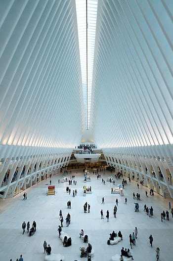 Modern architectural view of the Oculus in NYC, showcasing its futuristic design and bustling interior. HD phone wallpaper