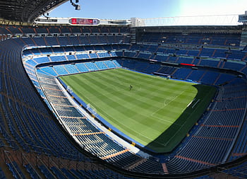 High-angle view of the empty Santiago Bernabeu Stadium on a sunny day in Madrid, Spain. HD wallpaper