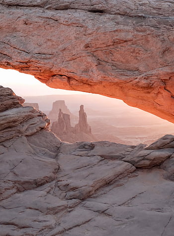 Stunning sunrise view through Mesa Arch in Canyonlands National Park, Utah. HD phone wallpaper