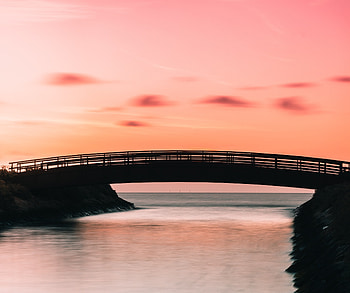 Bridge, silhouette, coast, sunset HD wallpaper