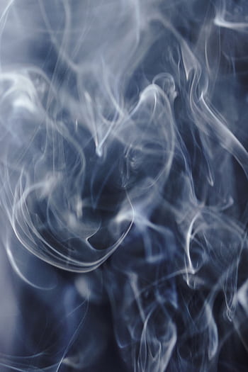 A captivating abstract of swirling smoke creating dynamic patterns against a dark backdrop. HD phone wallpaper