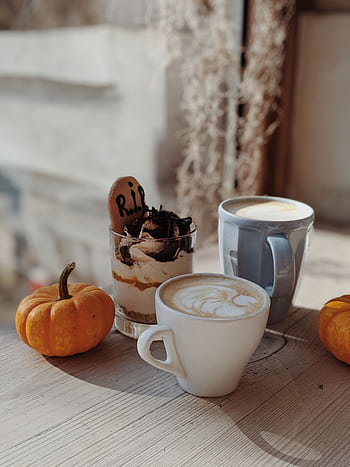 Warm autumn setup with coffee, dessert, and pumpkins on a wooden table. HD phone wallpaper