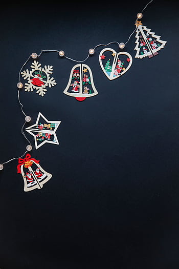 Colorful Christmas decorations and garland on a black background. HD phone wallpaper
