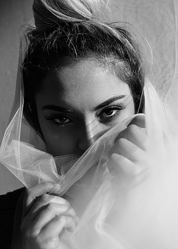 Artistic black and white portrait featuring a woman with expressive eyes and a veil creating a mysterious mood. HD phone wallpaper