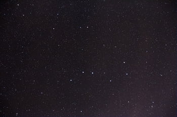 A serene and expansive view of the starry night sky depicting numerous stars and constellations. HD wallpaper