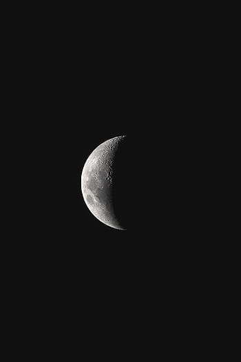 A detailed view of the crescent moon set against a dark night sky, showcasing lunar texture. HD phone wallpaper