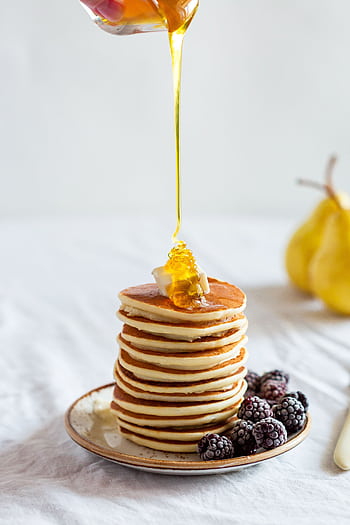 Mouthwatering stack of pancakes drizzled with honey, garnished with blackberries. HD phone wallpaper