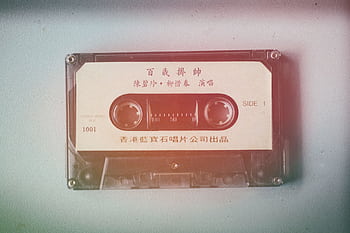 Retro cassette tape featuring Chinese text, perfect for vintage music themes. HD wallpaper