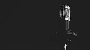 Close-up view of a studio micro against a dark background, emphasizing audio technology. HD wallpaper