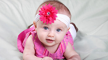 Cute Girl Baby Is Lying Down On Bed Wearing Pink Color Dress Cute HD wallpaper