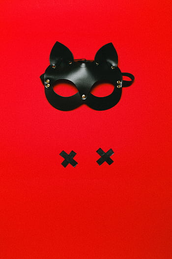 Black leather mask with a bold red backdrop suggesting themes of mystery and sensuality. HD phone wallpaper