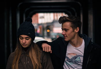 Teenagers sharing a moment outdoors in Stratford, Canada. HD wallpaper