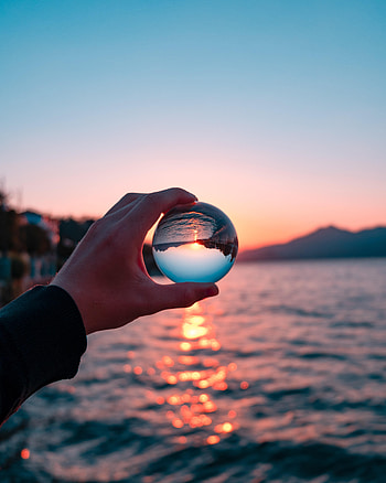 Sunset, Reflection, Hand, Miscellanea, Miscellaneous, Ball, Crystal Ball HD phone wallpaper