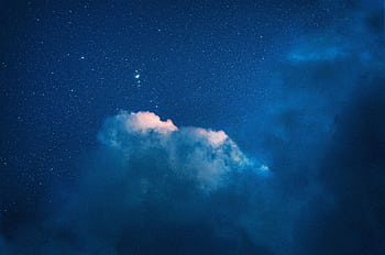 A serene night sky filled with stars and dramatic clouds, perfect for a calming background. HD wallpaper