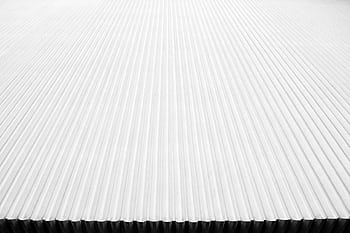 Abstract close-up of a modern corrugated metal roof with linear patterns in white. HD wallpaper