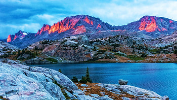 Sunset breaks through a growing storm on the Continental Divide, Bridger-Teton National Forest, Wyoming, lake, usa, clouds, landscake, trees, sky, mountains HD wallpaper