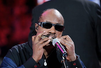 Stevie Wonder plays harmonica, Collaborating with Elton John, Musical talents, Legendary duo HD wallpaper