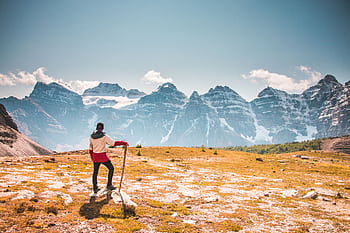 Hiker with a stick overlooking the beautiful Canadian Rockies in Banff National Park. HD wallpaper
