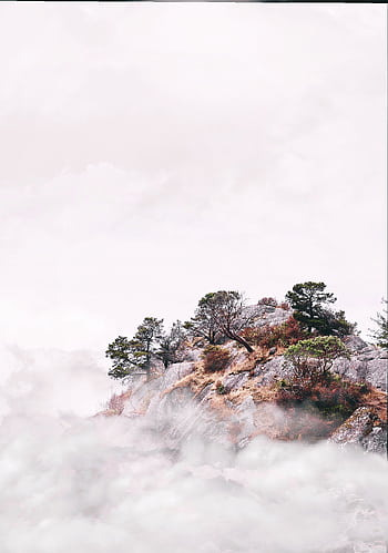 Scenic view of a mist-covered mountain peak in West Vancouver, Canada, showcasing nature's beauty. HD phone wallpaper