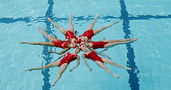 Elegant water ballet, Synchronized grace, Female swimmers, Fluid motion HD wallpaper