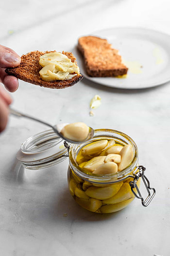 Garlic confit recipe, Stovetop method, Gourmet delight, Cooking technique HD phone wallpaper