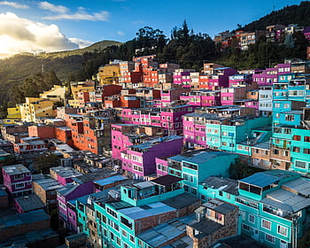 Aerial view of vibrant, colorful houses on a hillside in Bogotá, Colombia. HD wallpaper