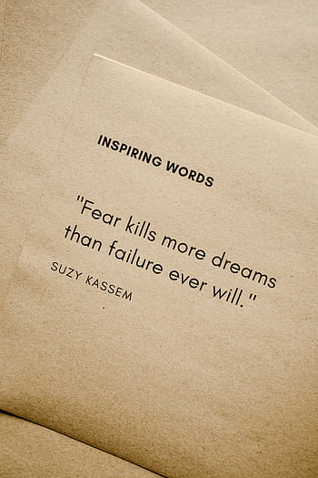 Motivational quote 'Fear kills more dreams than failure ever will.' by Suzy Kassem on paper texture. HD phone wallpaper
