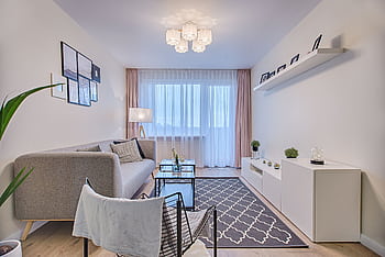 Elegant modern living room in Vilnius featuring contemporary furniture and decor. HD wallpaper